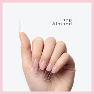 Curacoro Long Almond Soft Gel Nail Tips on a hand, featuring natural nails with clear extensions, set against a light gray background with a pink border.