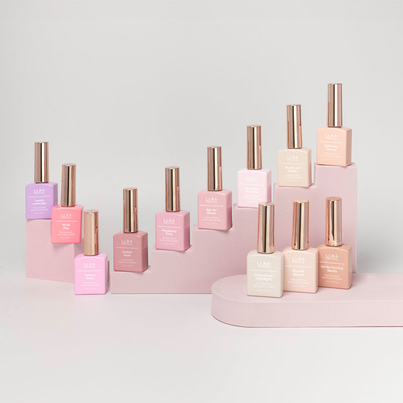 Curacoro ProNail Beverly Hills Nudes Collection features 12 nail polish bottles in various nude, arranged on a light pink display.