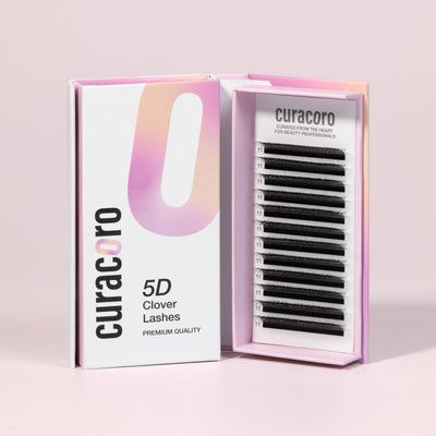 An open box of Curacoro 5D Clover Lashes premium quality eyelash extensions in black, with a 0.07 thickness.