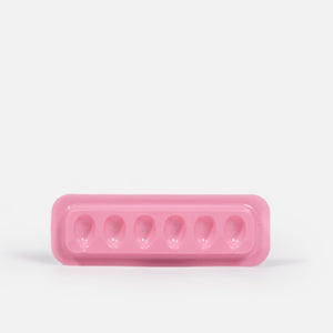 Individual Disposable Glue Holder Over White Background