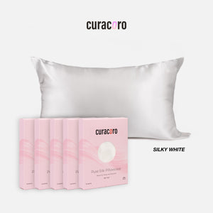 Curacoro Pure Silk Pillowcase in Himalayan silky white, featuring a soft, luxurious texture with packaging.