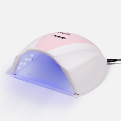 Professional 108W UV LED Nail Lamp with light on over white background