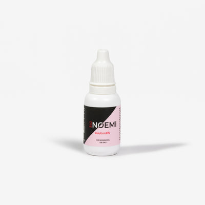 Noemi Solution 6% Bottle Over White Background