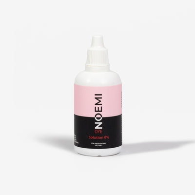 Noemi Solution 6% Bottle Over White Background