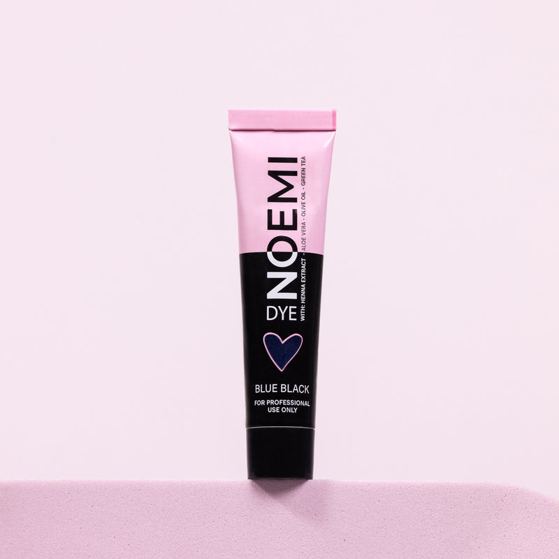 Noemi Hybrid Brow & Lash Dye - Blue Black Bottle Over Pink Background