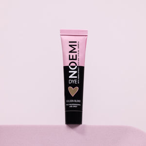 Noemi Hybrid Brow & Lash Dye - Golden Blond Bottle Over Pink Background