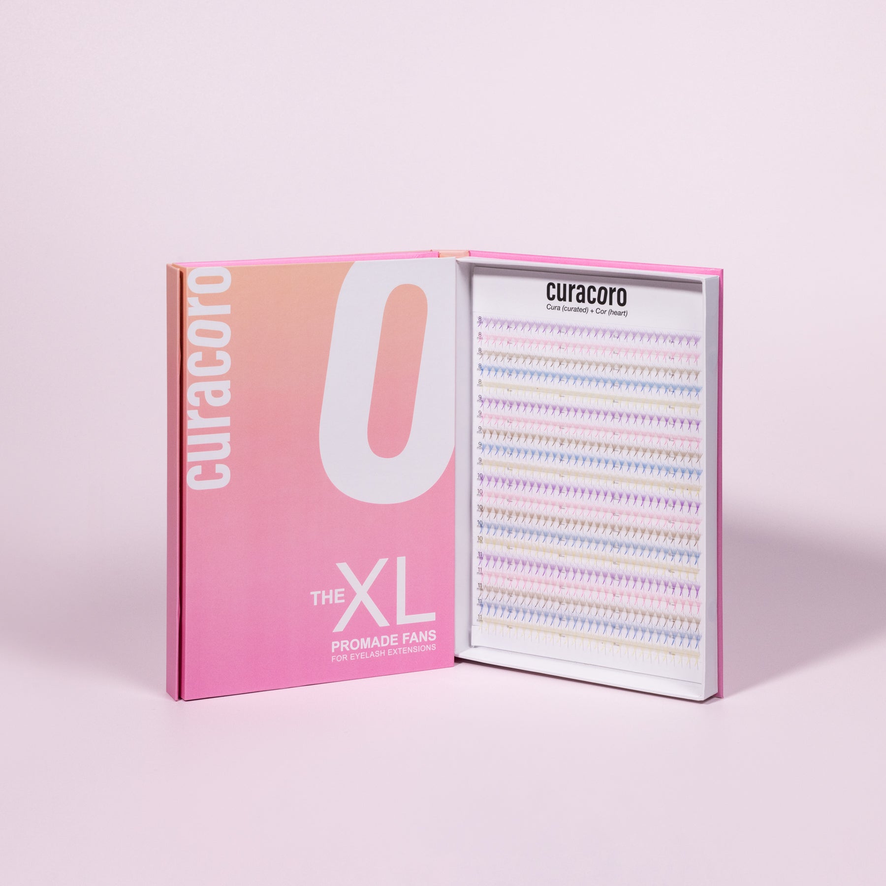 Curacoro XL Promade Fans tray with rainbow-colored lash extensions, displayed in an open box with pink gradient packaging.