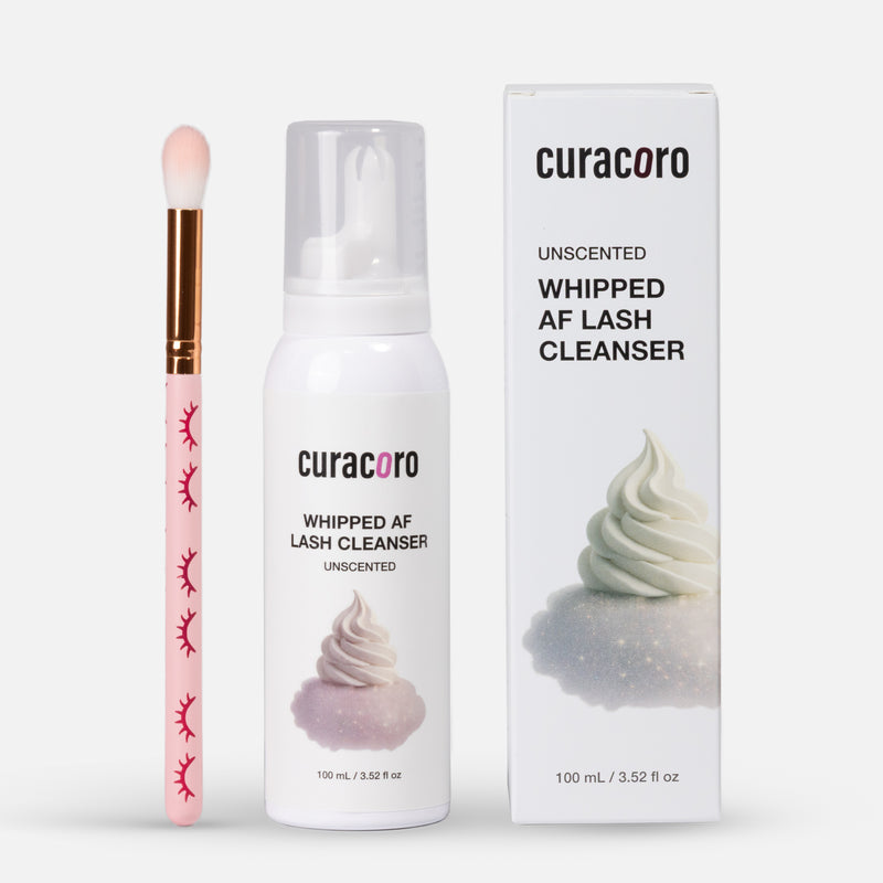 Curacoro lash cleanser with applicator and packaging on a white background