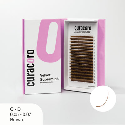 Curacoro Velvet Supermink lash tray in C-D curl, 0.05 - 0.07 thickness, and black color, displayed in an open pink and white box with a close-up curve icon on a white background.