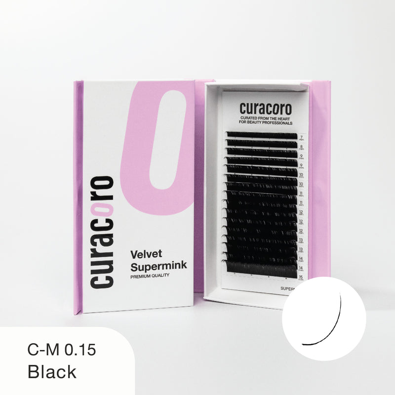 Curacoro Velvet Supermink lash tray in C-M curl, 0.15 thickness, and black color, displayed in an open pink and white box with a close-up curve icon on a white background.