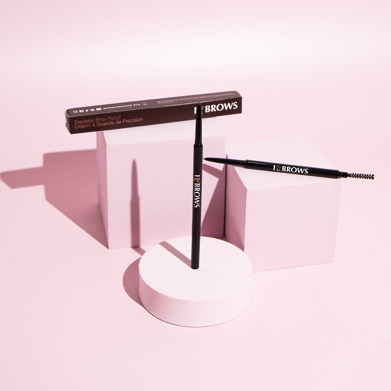 I ❤️ Brows Brow Pencil in front of a pink background.