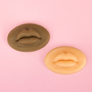 White and dark styles of 3D Silicone Lips standing in front of a pink background.