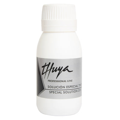 Thuya Special Solution Dye in a white bottle with a sleek gray label, ideal for professional hair tinting applications.