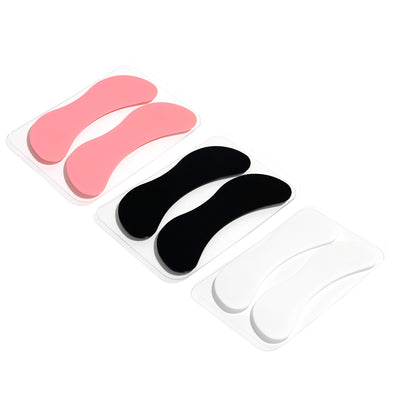 Reusable Silicone Under Eye Pad in front of white background.