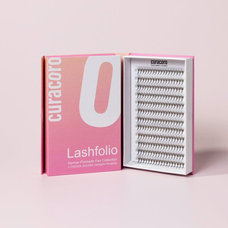 Lashfolio 12D 0.03 in front of a pink background with an open case.