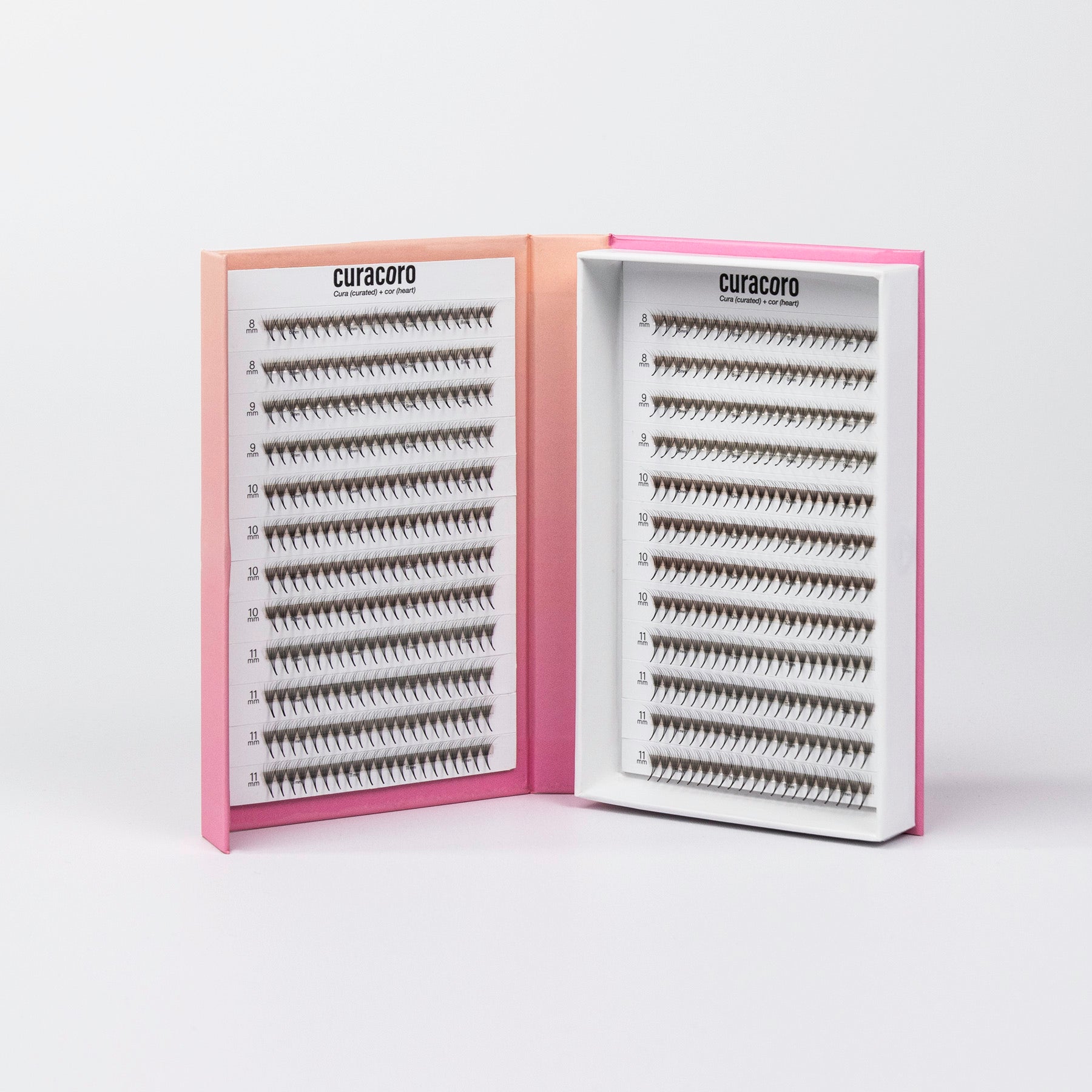 Curacoro Lashfolio lashes in pink gradient packaging with open tray displaying dense lash fans.