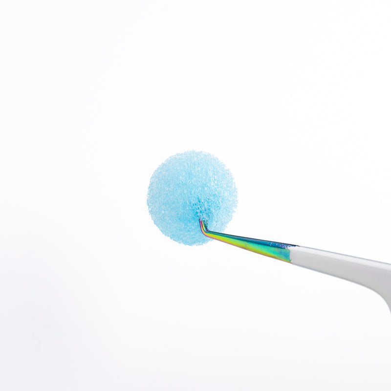 Tweezer Sponge Cleanser Hold by a Tweezer Close Up