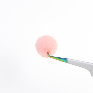 Tweezer Sponge Cleanser Hold by a Tweezer Close Up