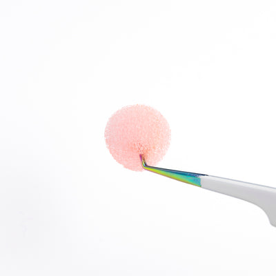 Tweezer Sponge Cleanser Hold by a Tweezer Close Up