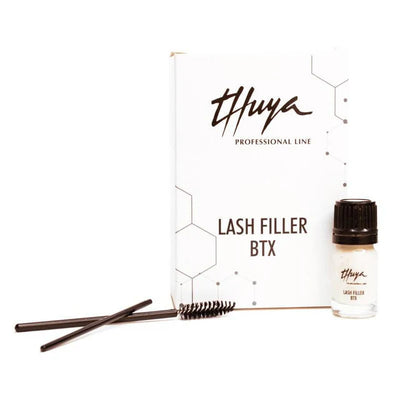 Thuya Lash Filler BTX set includes a treatment bottle, spoolie brushes, and elegant packaging for lash nourishment and enhancement.