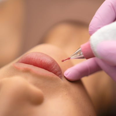 PIXL needle cartridge in use with a model's lips displayed