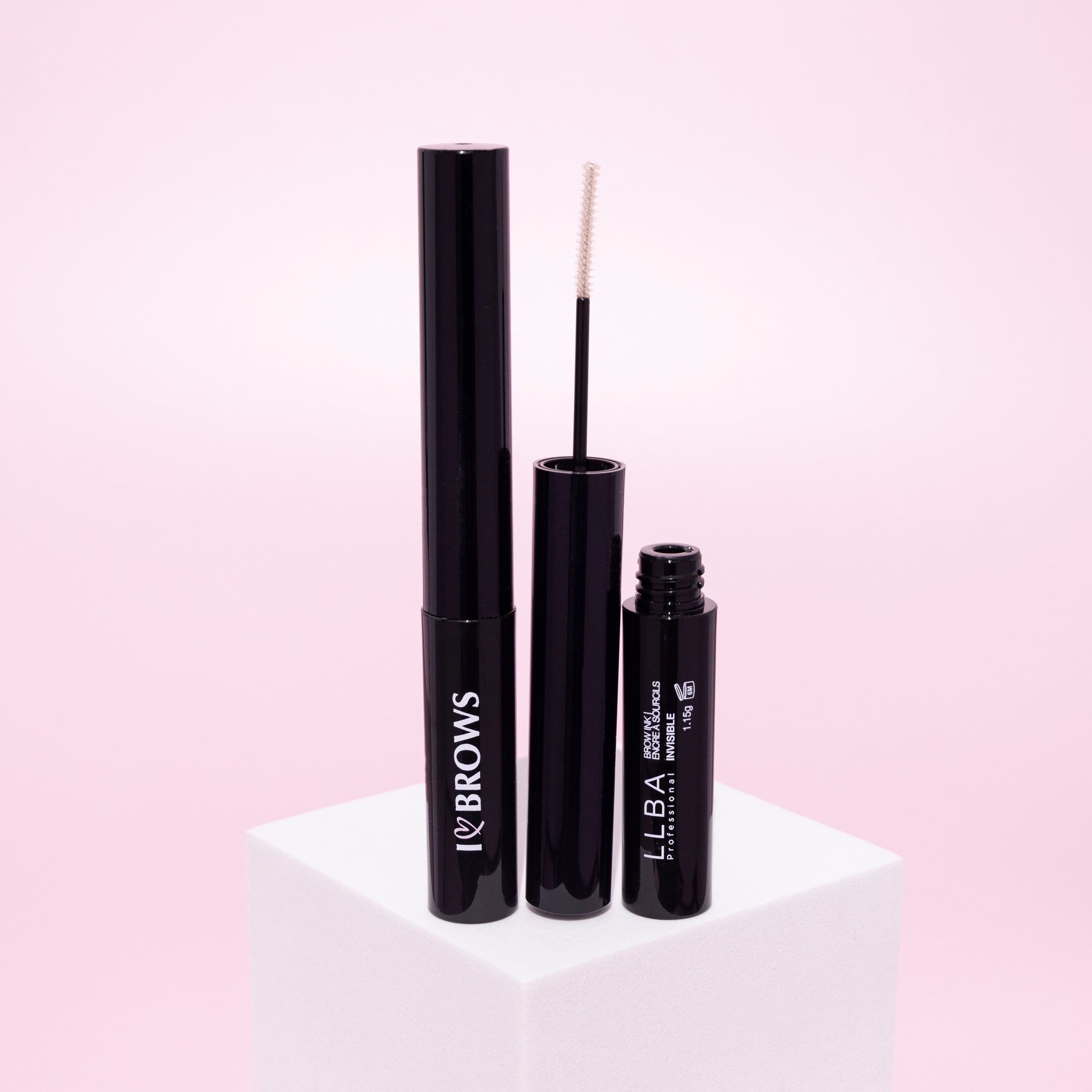 I ❤️  Brows Brow Gel Ink - Invisible with brush applicator, displayed on a pink background.